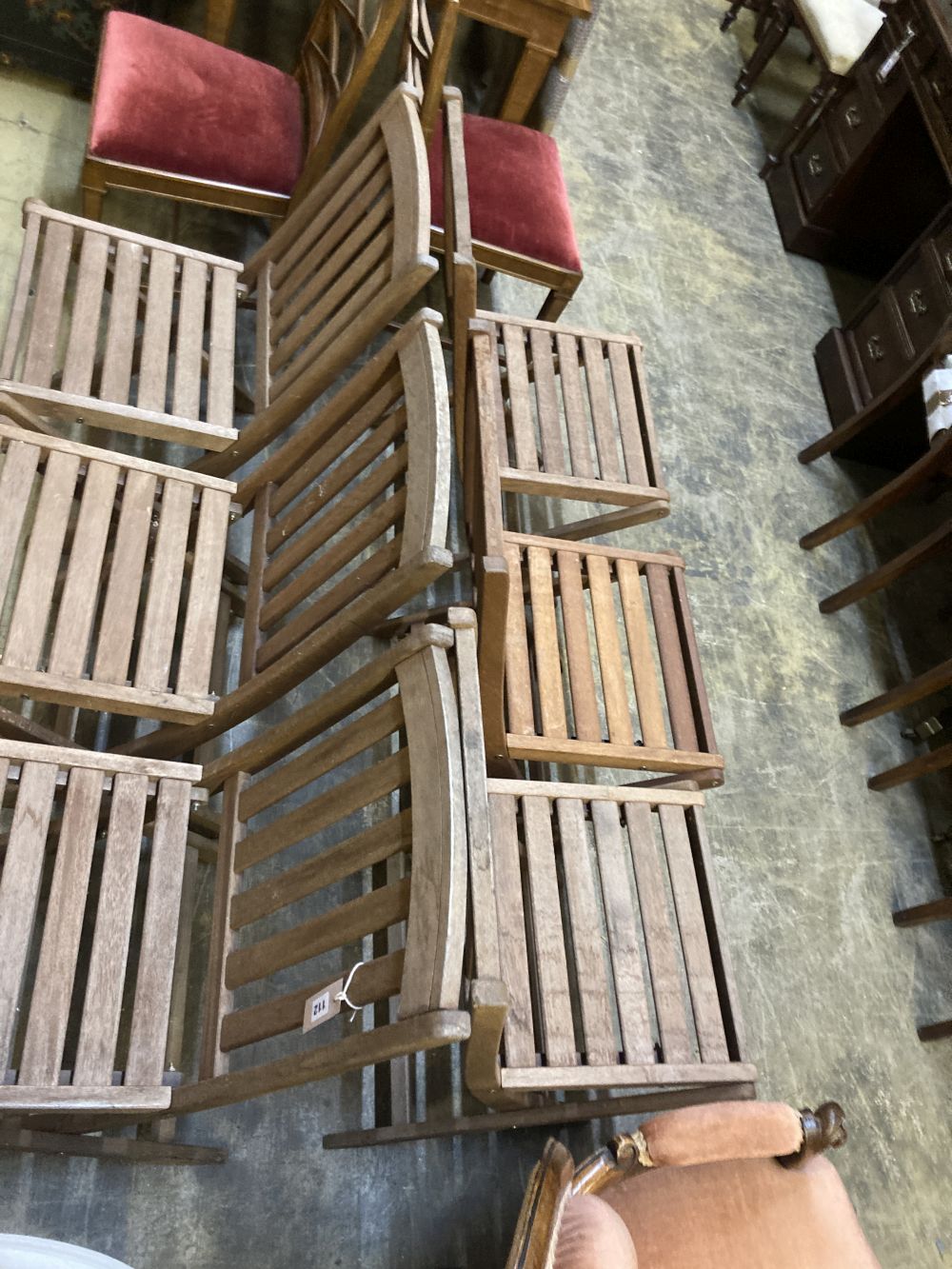 A set of six teak folding garden chairs